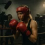Sydney Sweeney's Boxing Concussion: Euphoria Star Injured Filming Christy Martin Biopic Young blonde female actress in boxing gear and protective headgear during intense training scene