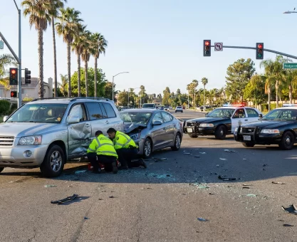 Severe car crash scene at an intersection in California involving a large SUV and another vehicle