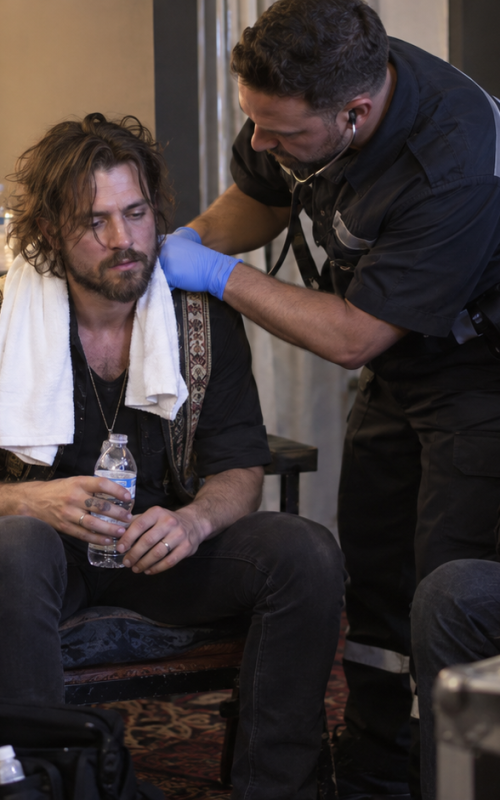 Folk rock singer recovering backstage after onstage collapse