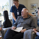 Older singer recovering after brain shunt surgery with medical support