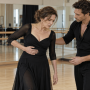 Actress experiencing rib pain during intensive dance rehearsal