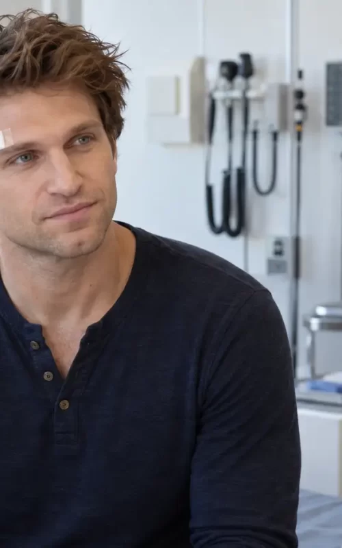 Male actor receiving medical care after a facial injury
