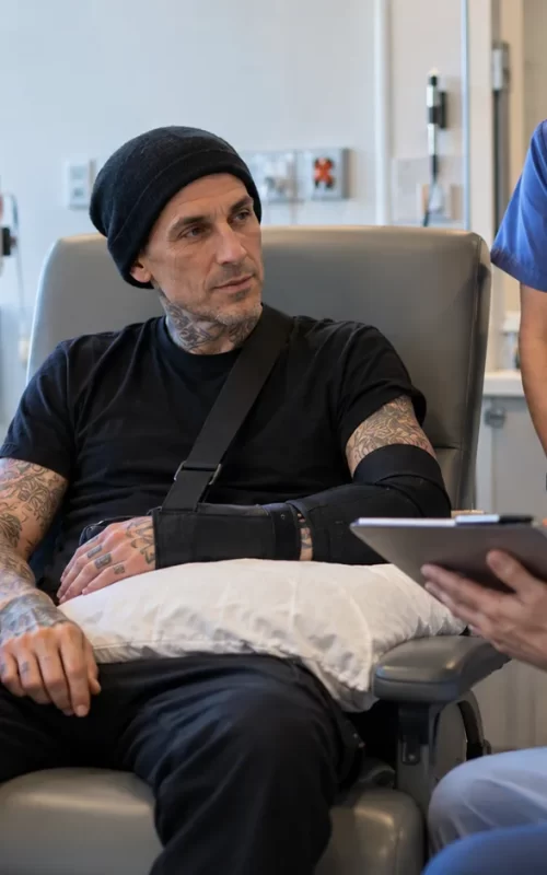 Tattooed drummer receiving medical care after nerve surgery